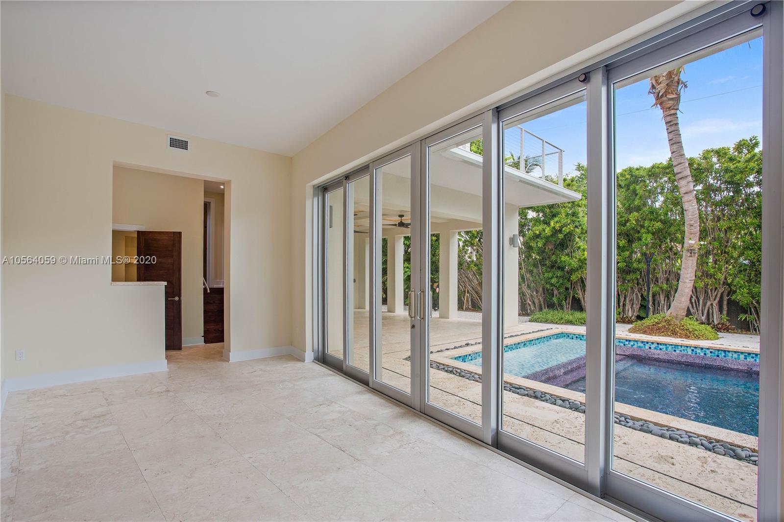 335 Pacific Road Key Biscayne, FL 33149 - Photo 17 of 50 a view of a room with a large window