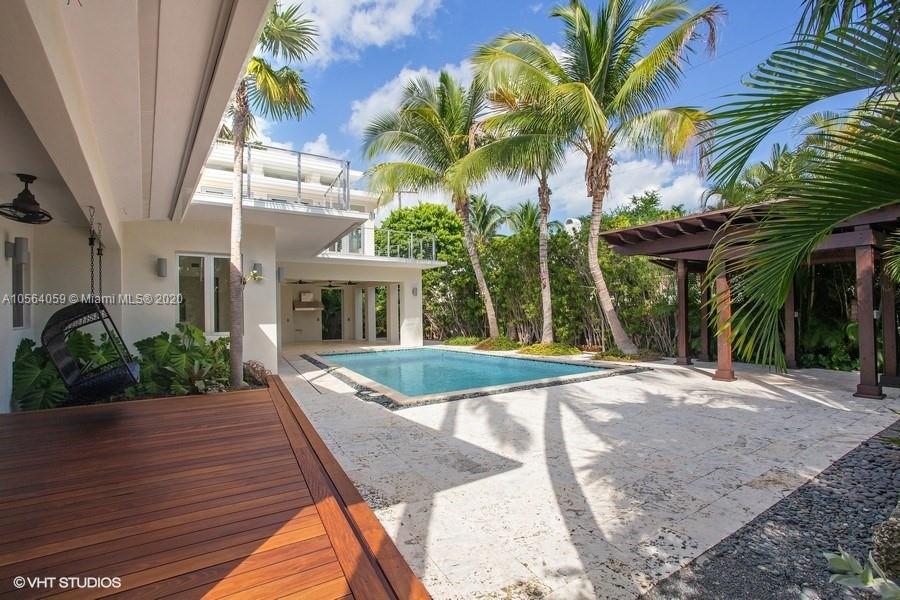 335 Pacific Road Key Biscayne, FL 33149 - Photo 2 of 50 a view of outdoor space yard and porch