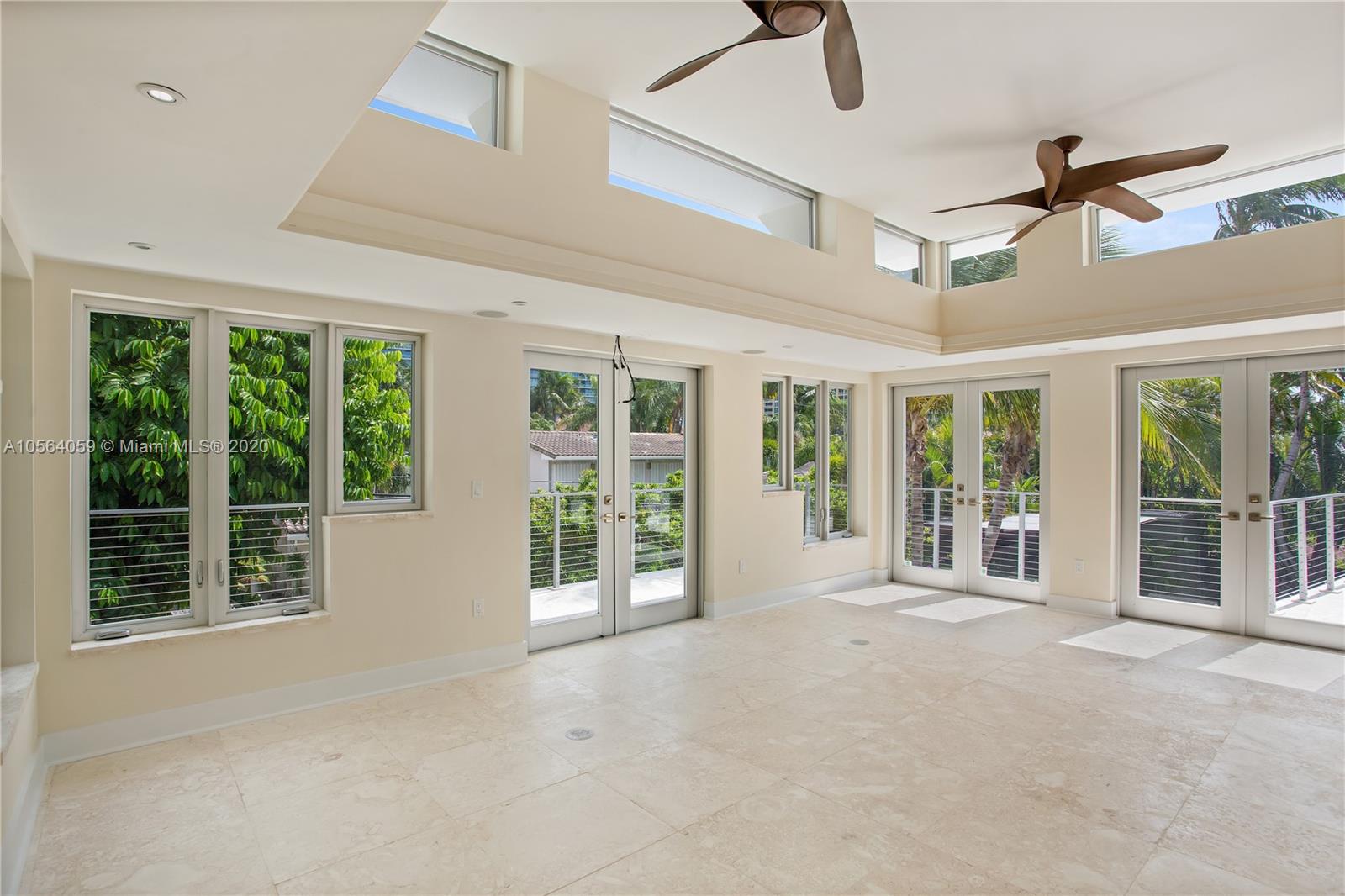 335 Pacific Road Key Biscayne, FL 33149 - Photo 26 of 50 a view of an empty room with a balcony