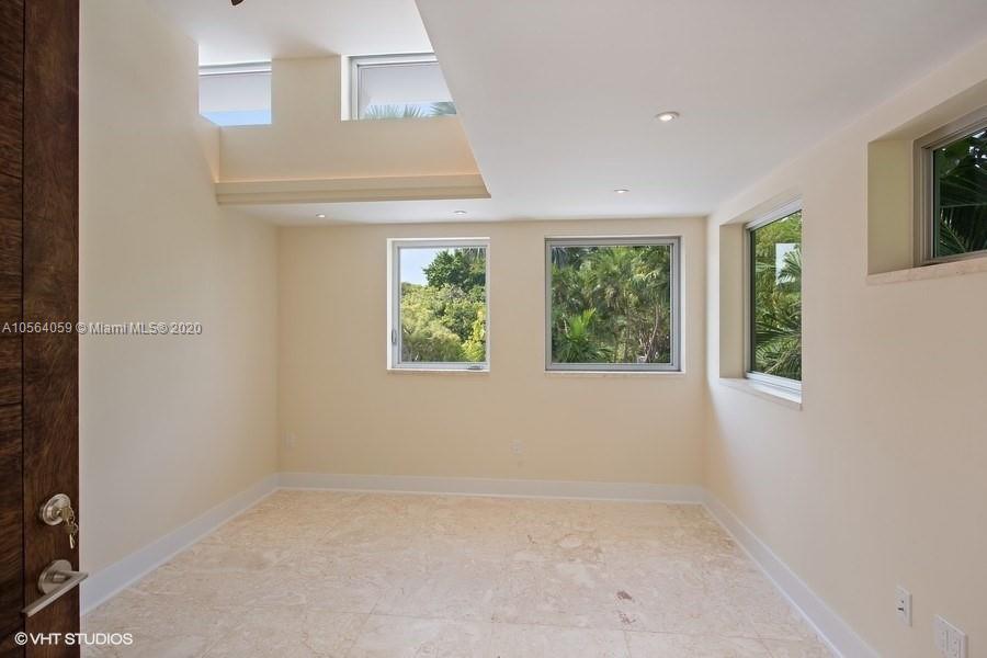 335 Pacific Road Key Biscayne, FL 33149 - Photo 28 of 50 an empty room with windows