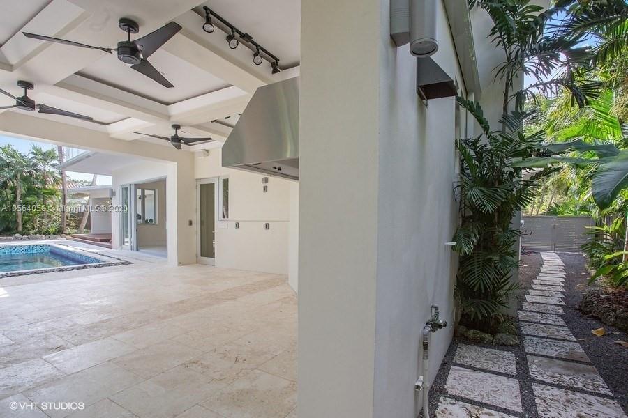 335 Pacific Road Key Biscayne, FL 33149 - Photo 34 of 50 a view of a house with a tree