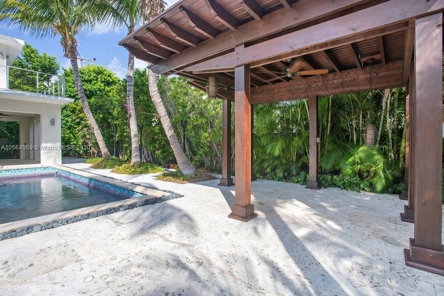 335 Pacific Road Key Biscayne, FL 33149 - Photo 37 of 50 a view of a backyard with a small cabin