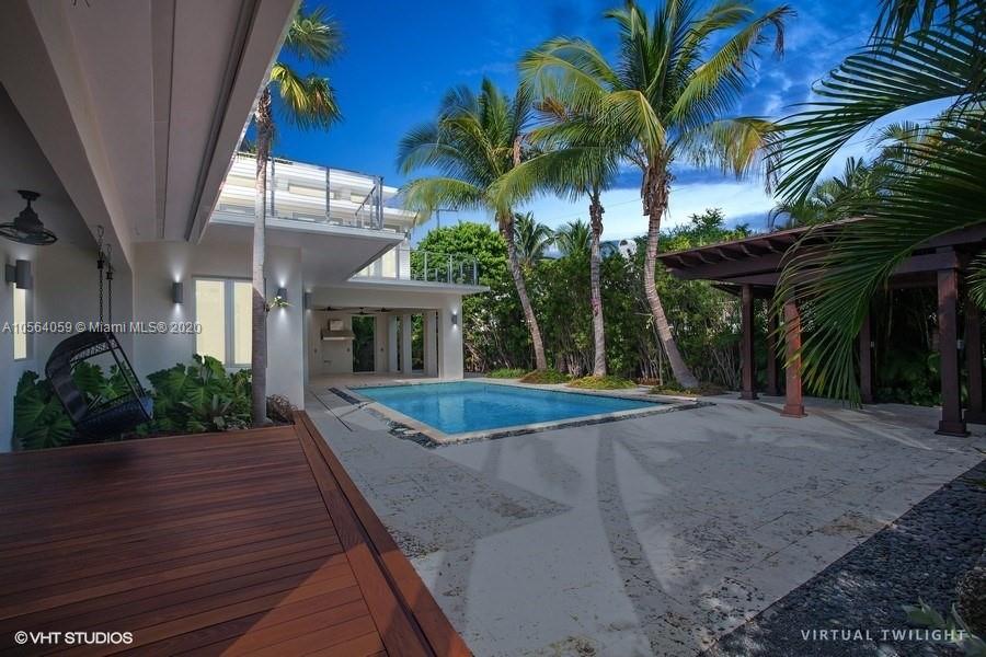 335 Pacific Road Key Biscayne, FL 33149 - Photo 38 of 50 a view of outdoor space yard and porch