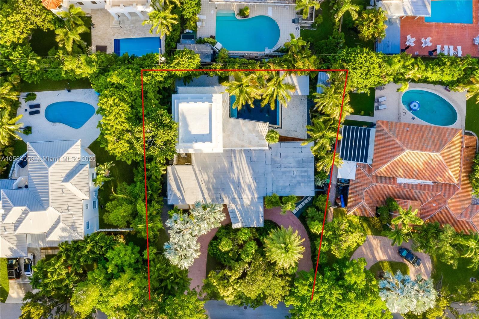 335 Pacific Road Key Biscayne, FL 33149 - Photo 44 of 50 an aerial view of a house with a yard and garden