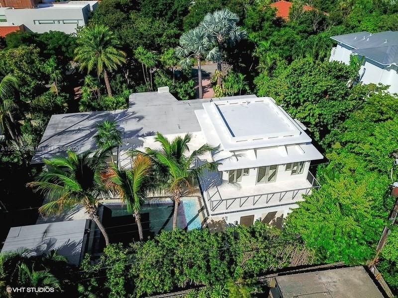 335 Pacific Road Key Biscayne, FL 33149 - Photo 46 of 50 an aerial view of a house with pool garden and plants