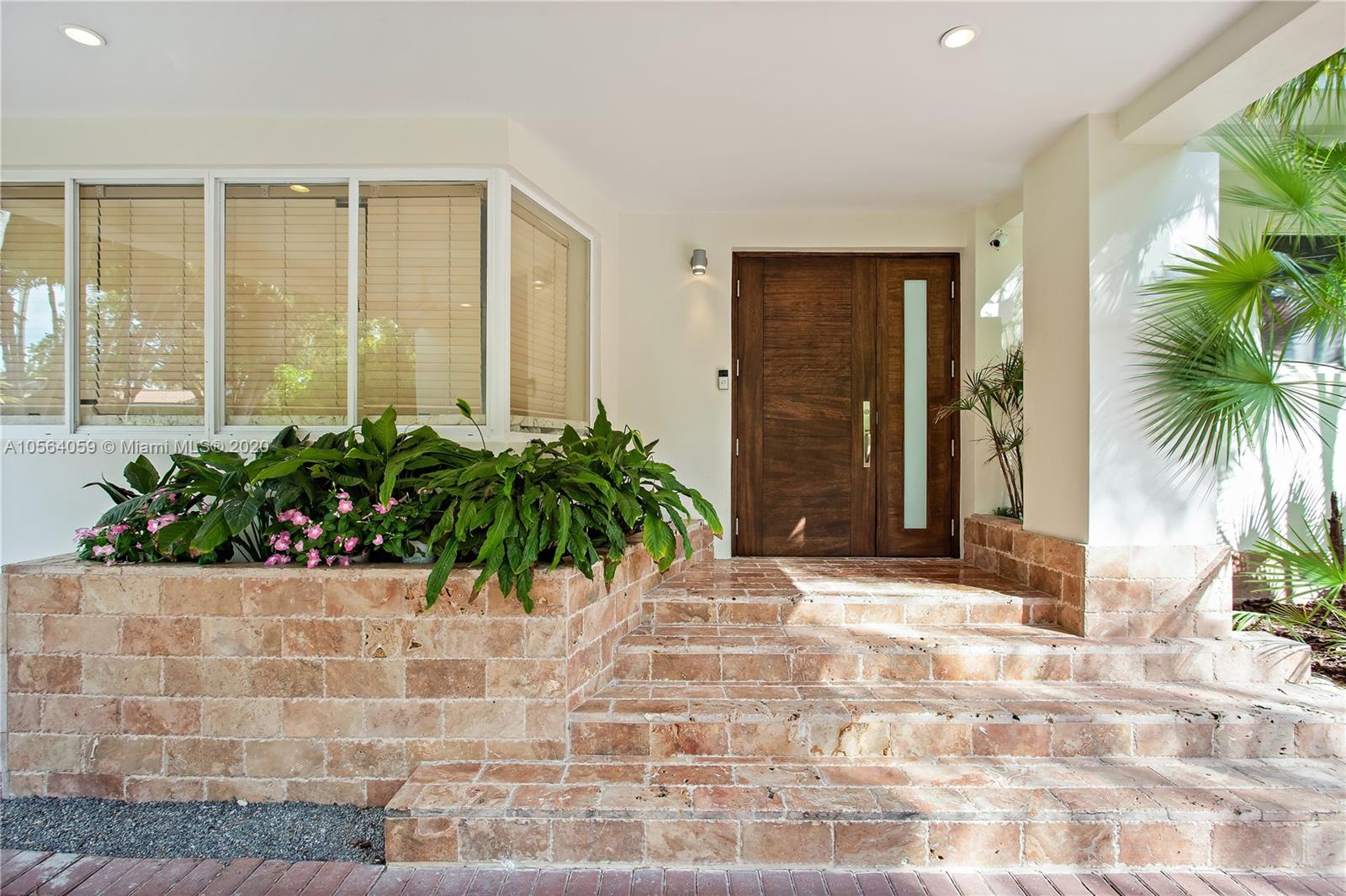 335 Pacific Road Key Biscayne, FL 33149 - Photo 6 of 50 a view of potted plants in front of door