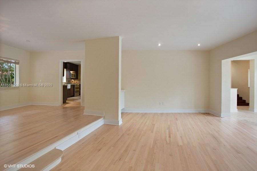 335 Pacific Road Key Biscayne, FL 33149 - Photo 10 of 50 wooden floor in an empty room with a window