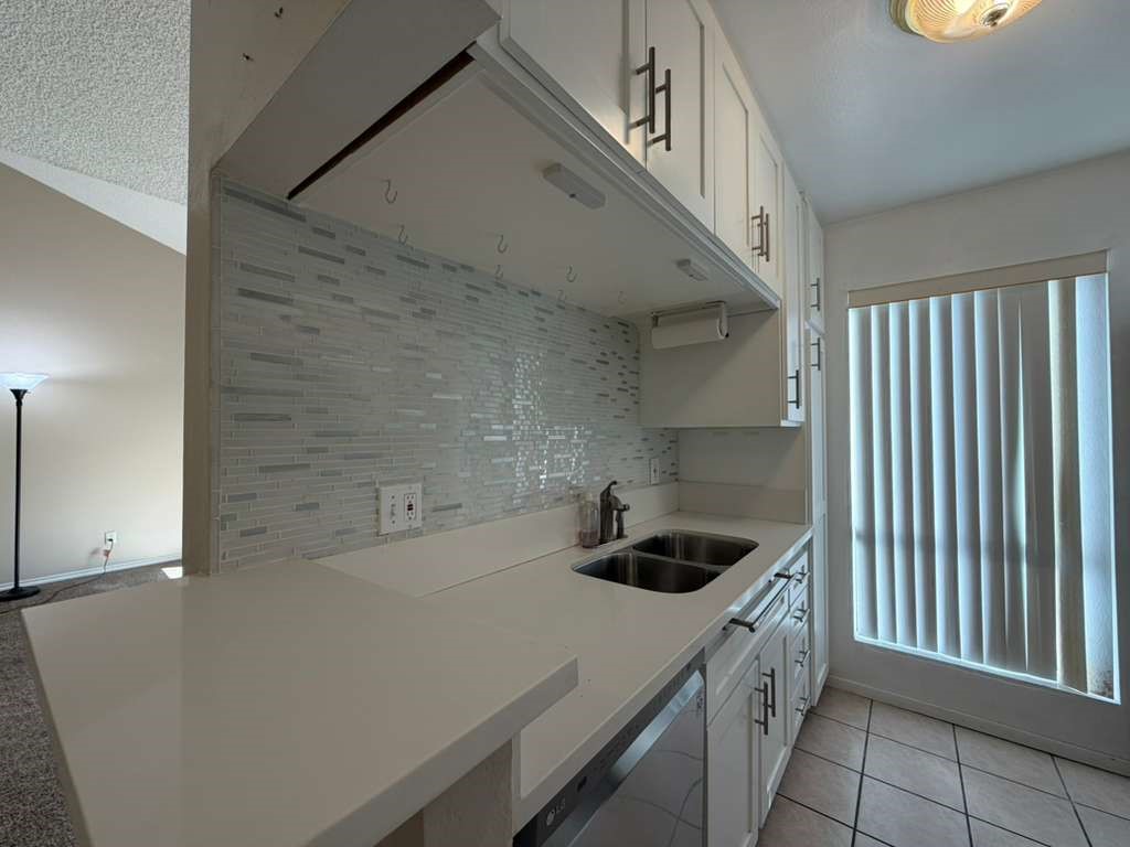 330 North Chapel Avenue, Unit 212 Alhambra, CA 91801 - Photo 15 of 25 a kitchen with a sink and cabinets