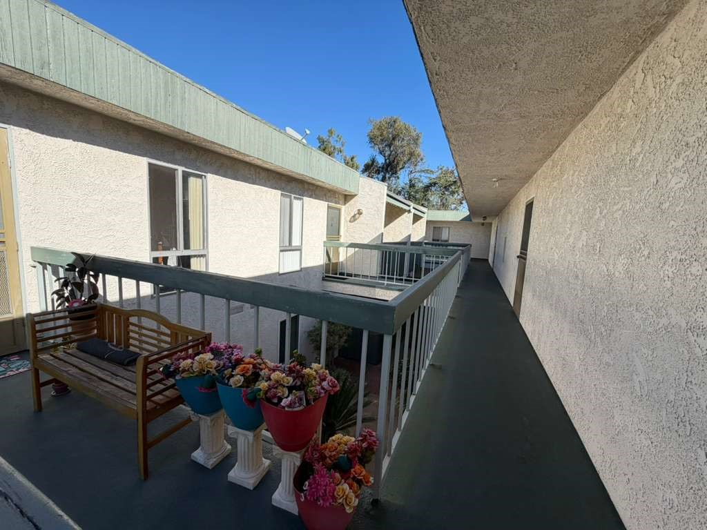 330 North Chapel Avenue, Unit 212 Alhambra, CA 91801 - Photo 17 of 25 a view of a chairs and table in a balcony