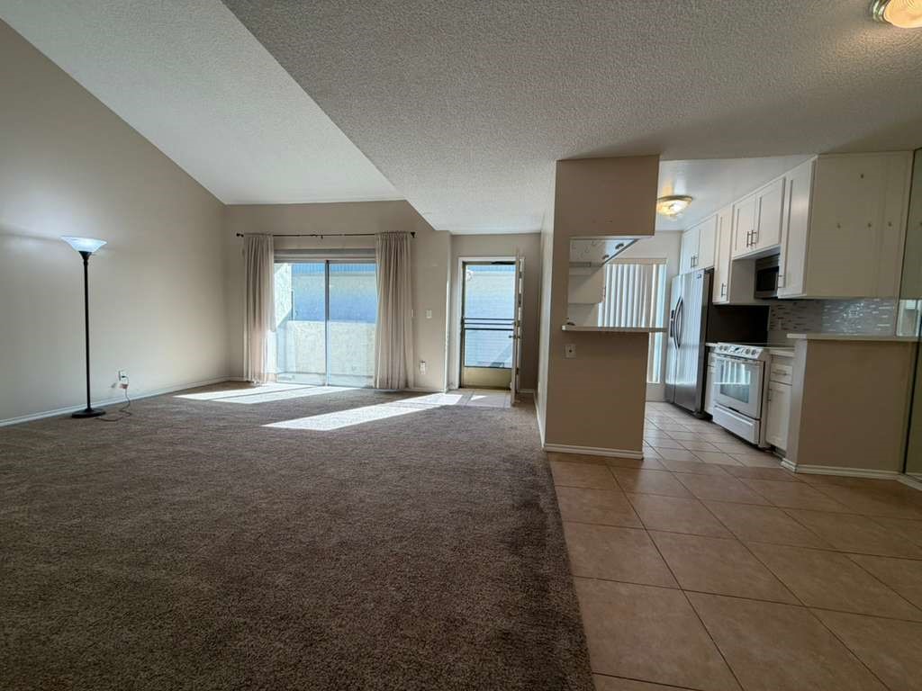 330 North Chapel Avenue, Unit 212 Alhambra, CA 91801 - Photo 21 of 25 a view of a kitchen and refrigerator in a kitchen