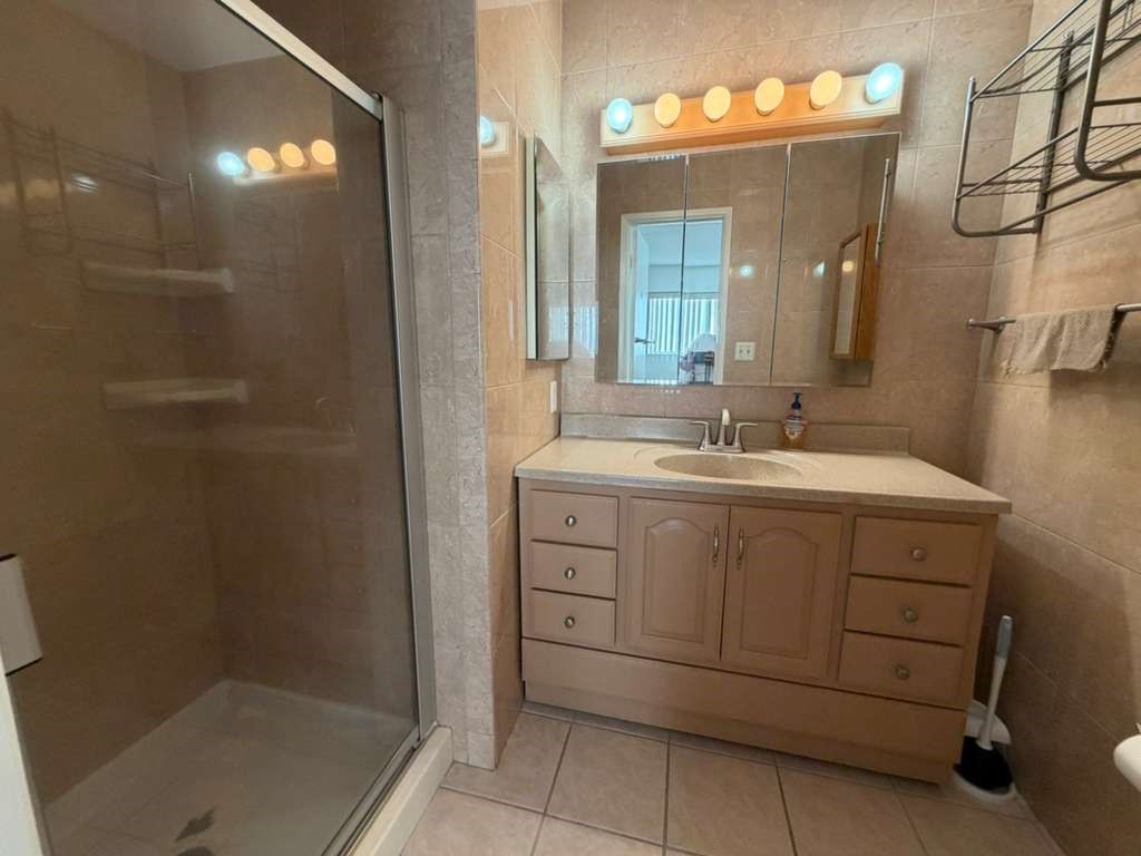 330 North Chapel Avenue, Unit 212 Alhambra, CA 91801 - Photo 4 of 25 a bathroom with a sink vanity and mirror