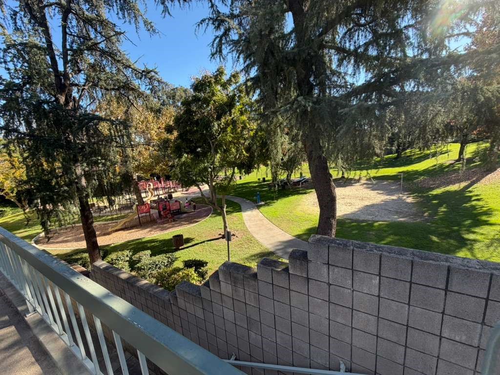 330 North Chapel Avenue, Unit 212 Alhambra, CA 91801 - Photo 9 of 25 a view of a swimming pool with a patio and a yard
