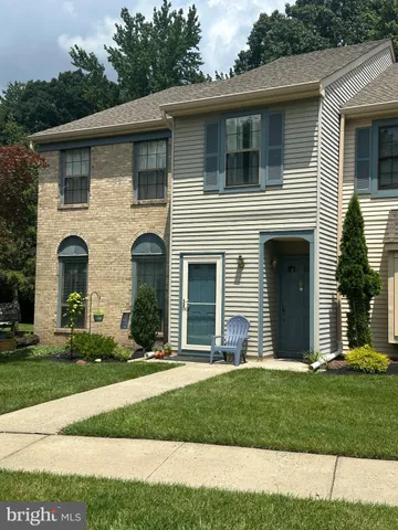 a view of a yard in front view of a house