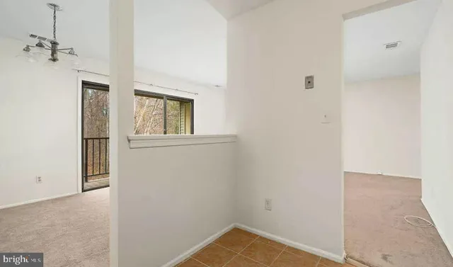 a view of a hallway with a white walls