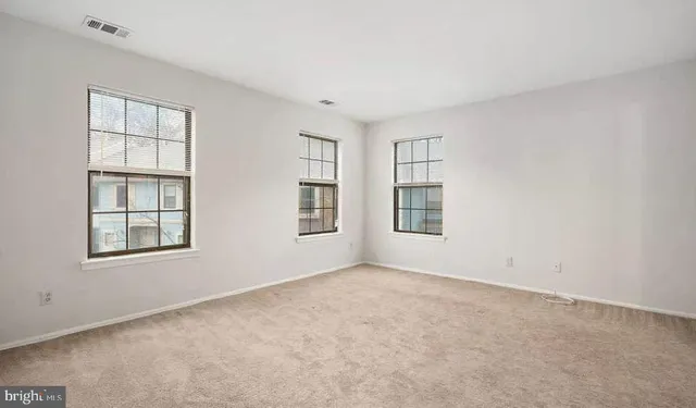 an empty room with windows