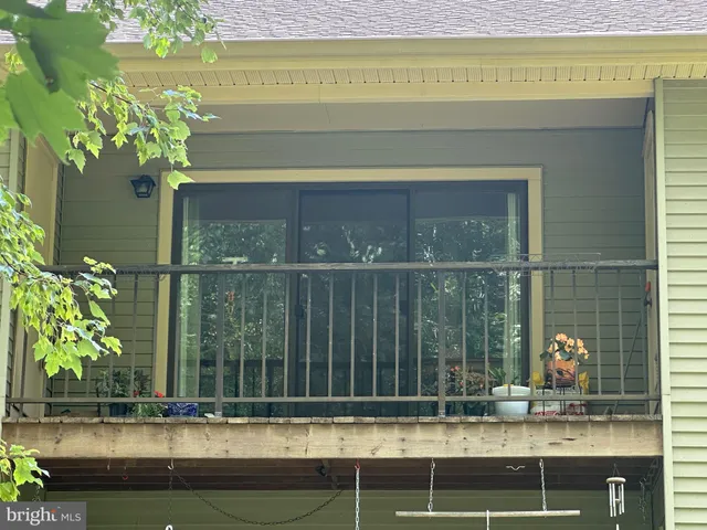 a view of a house with a window and a flower pot