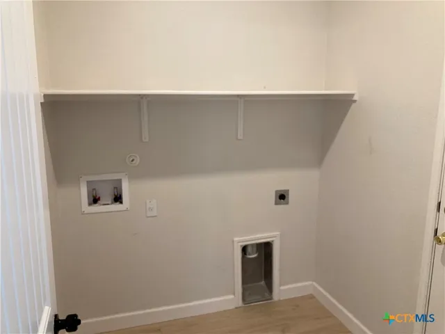 a view of a room with rack and white walls