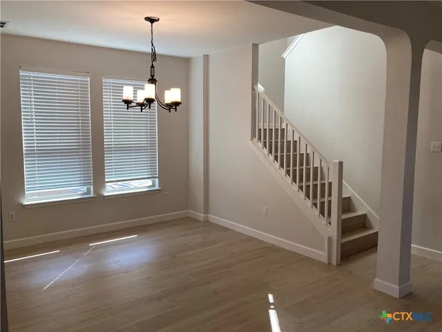 a view of a livingroom with a staircase
