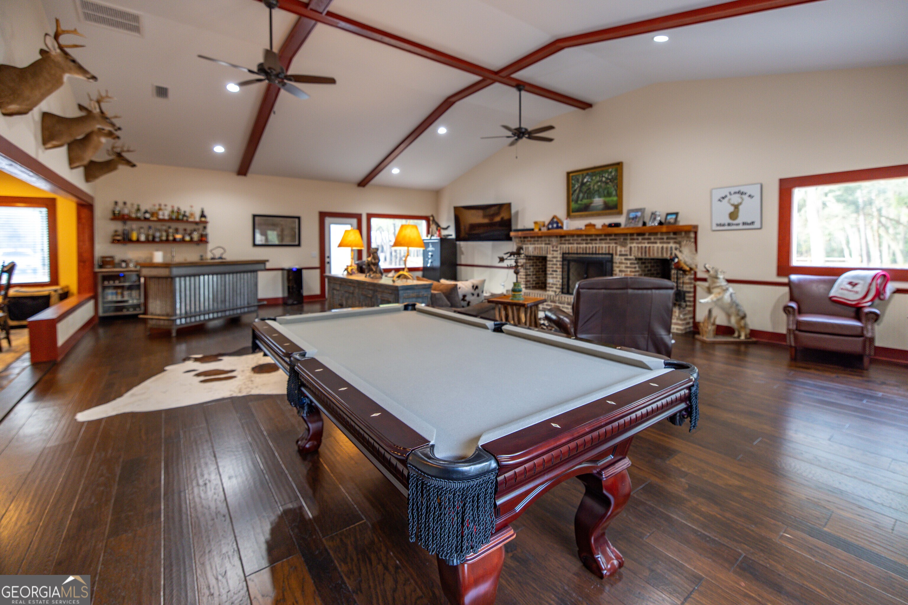 279 Mid River Road White Oak, GA 31568 - Photo 11 of 62 a room with lots of furniture and a wooden floor