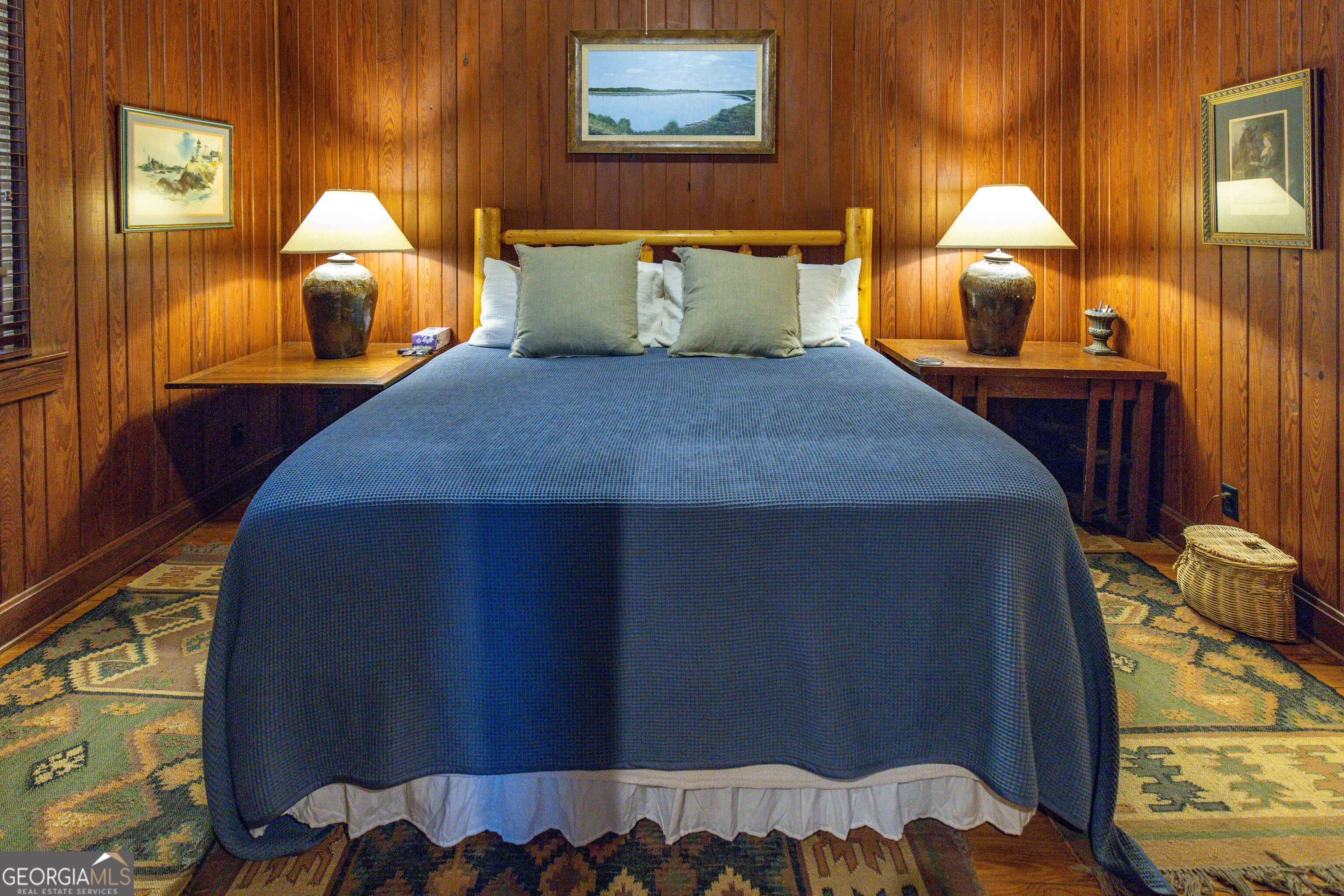 279 Mid River Road White Oak, GA 31568 - Photo 14 of 62 a bedroom with a bed and lamp next to a window