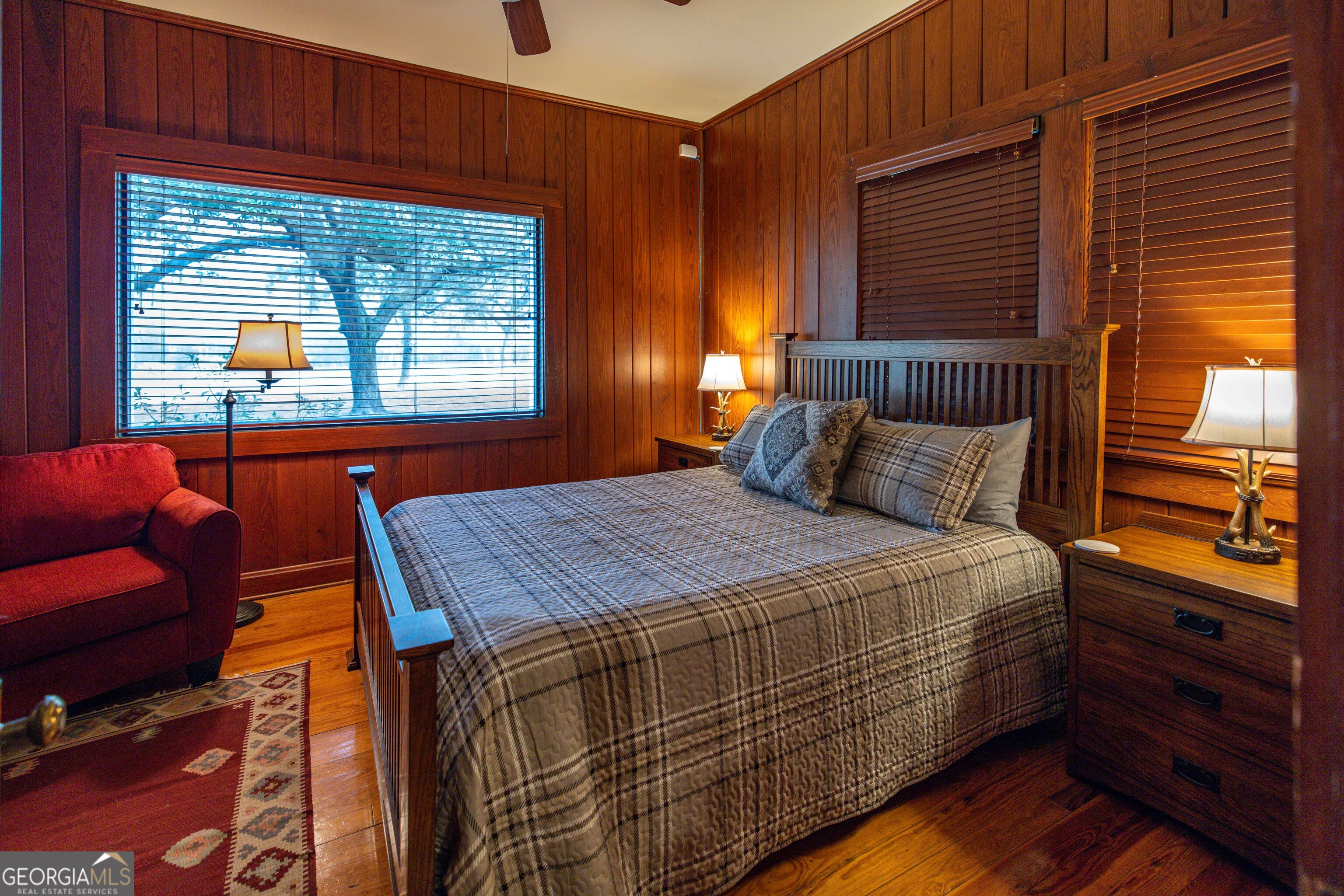 279 Mid River Road White Oak, GA 31568 - Photo 15 of 62 a bedroom with a bed and a window