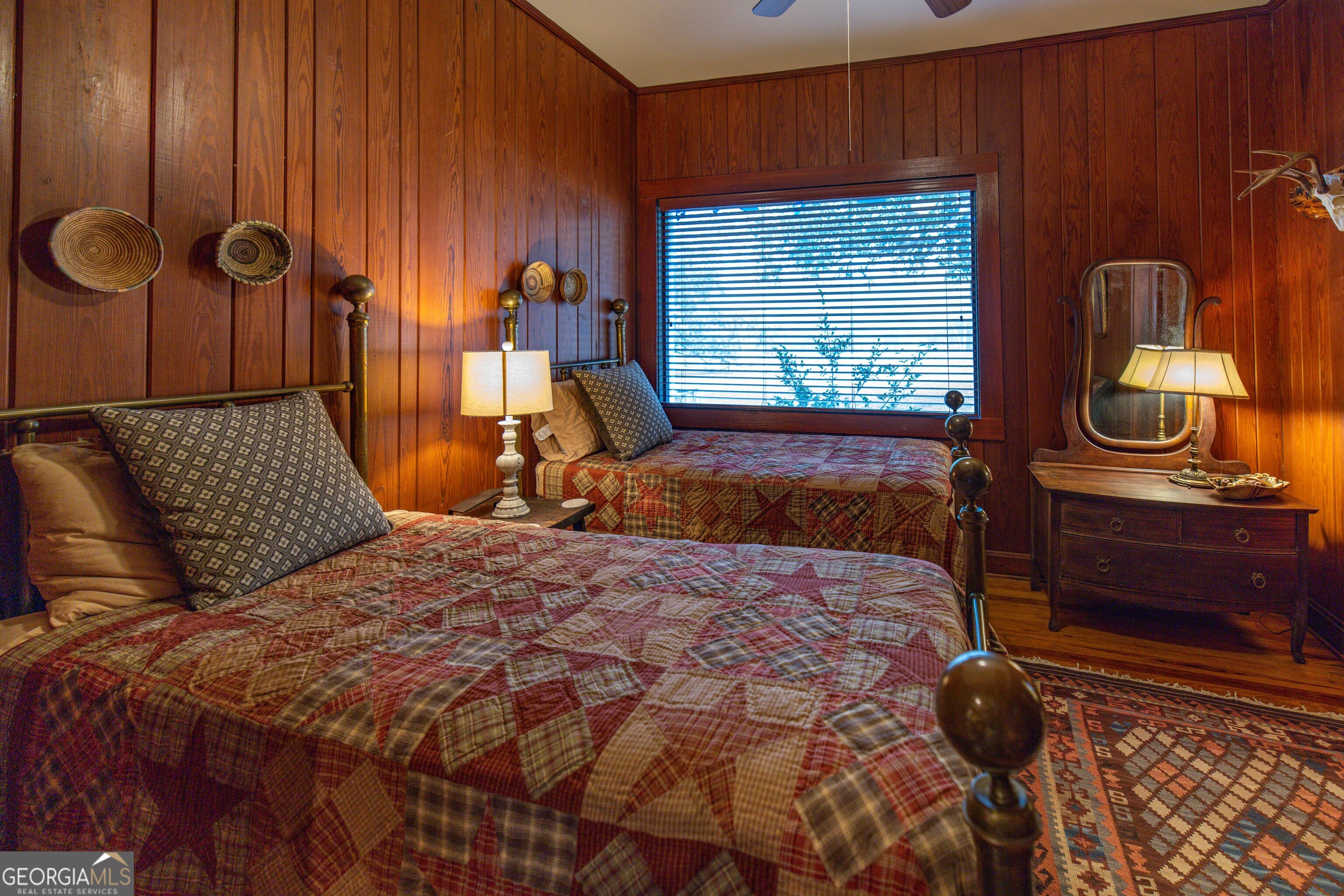 279 Mid River Road White Oak, GA 31568 - Photo 16 of 62 a bedroom with a bed and window