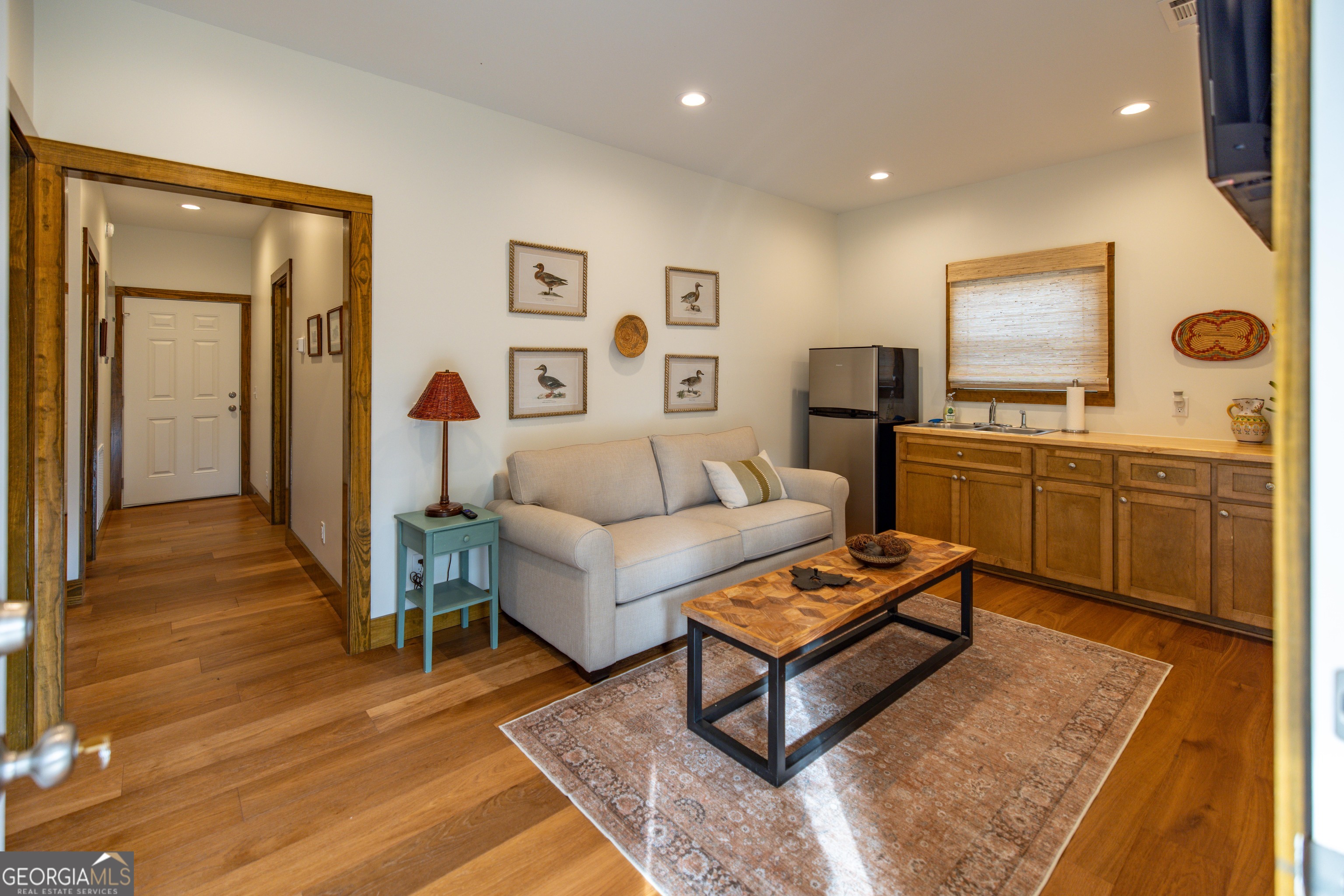 279 Mid River Road White Oak, GA 31568 - Photo 20 of 62 a living room with furniture and wooden floor