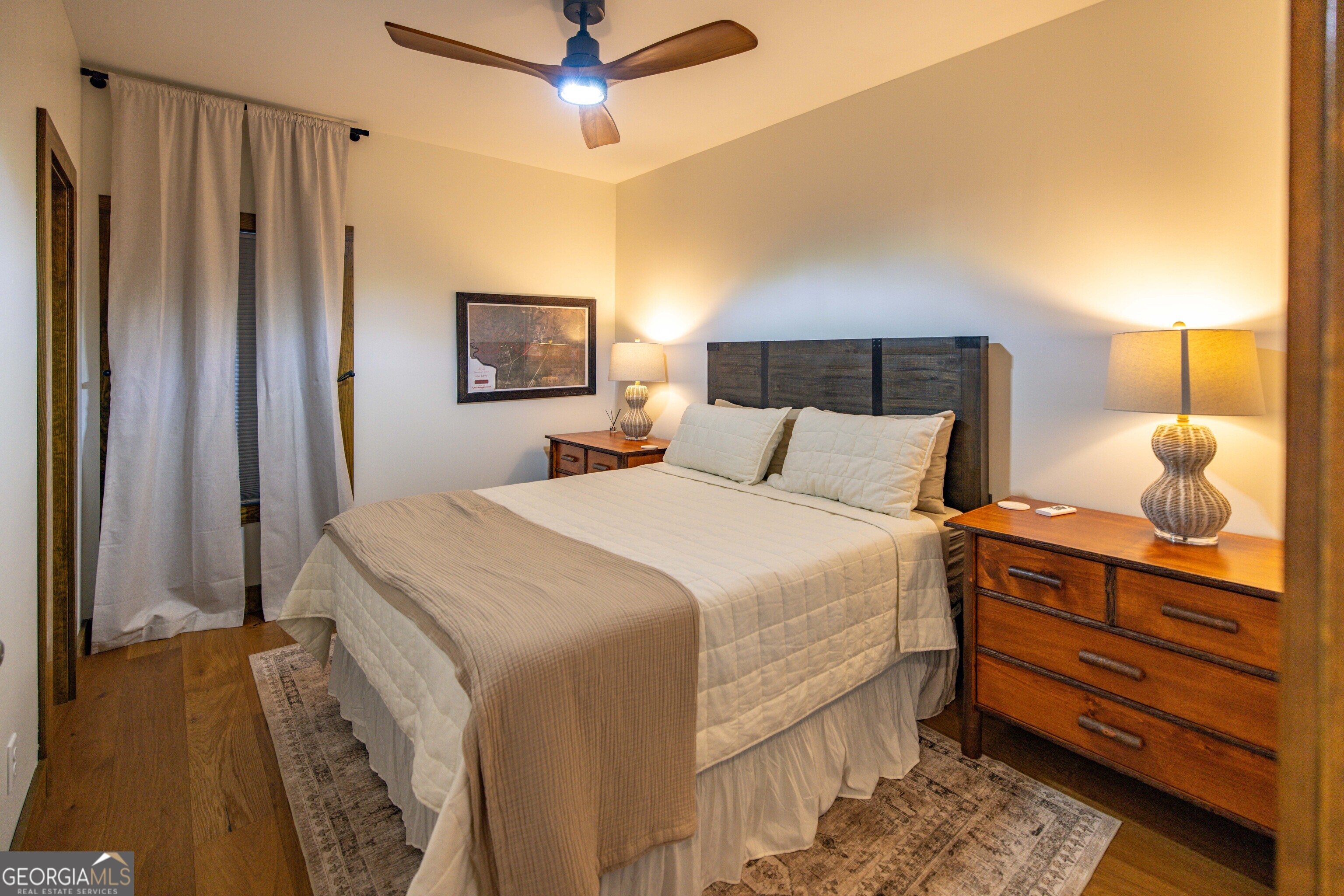 279 Mid River Road White Oak, GA 31568 - Photo 21 of 62 a bedroom with a bed and a dresser