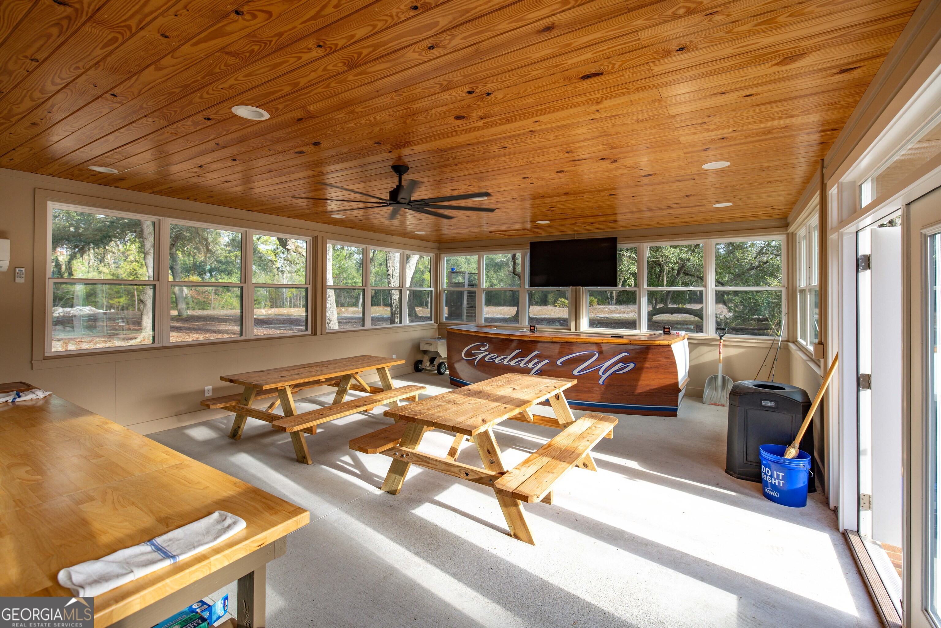 279 Mid River Road White Oak, GA 31568 - Photo 24 of 62 a view of a patio with a table and chairs next to a yard
