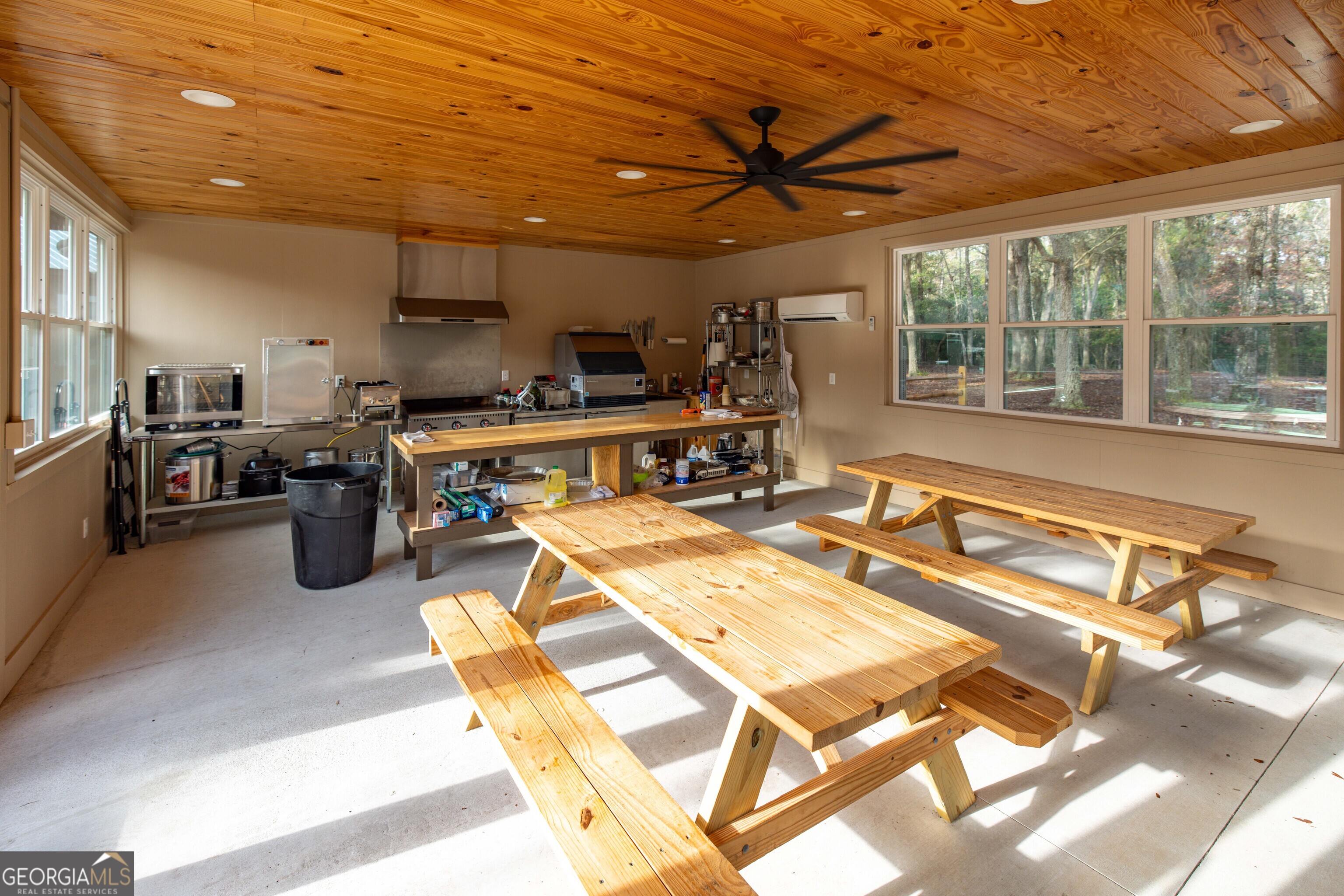 279 Mid River Road White Oak, GA 31568 - Photo 25 of 62 a room with gym equipment and a large window