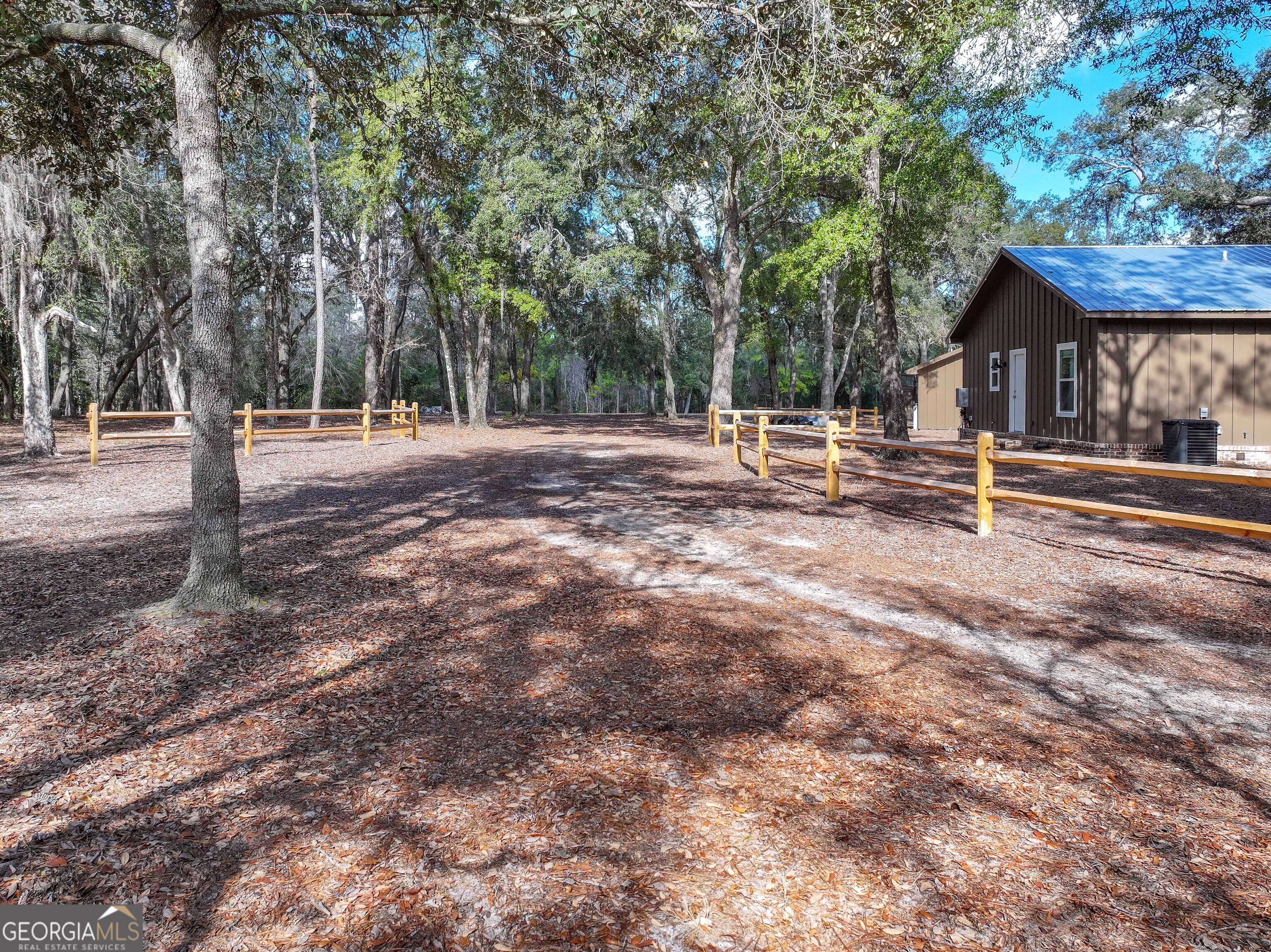 279 Mid River Road White Oak, GA 31568 - Photo 37 of 62 a view of a house with backyard and tree