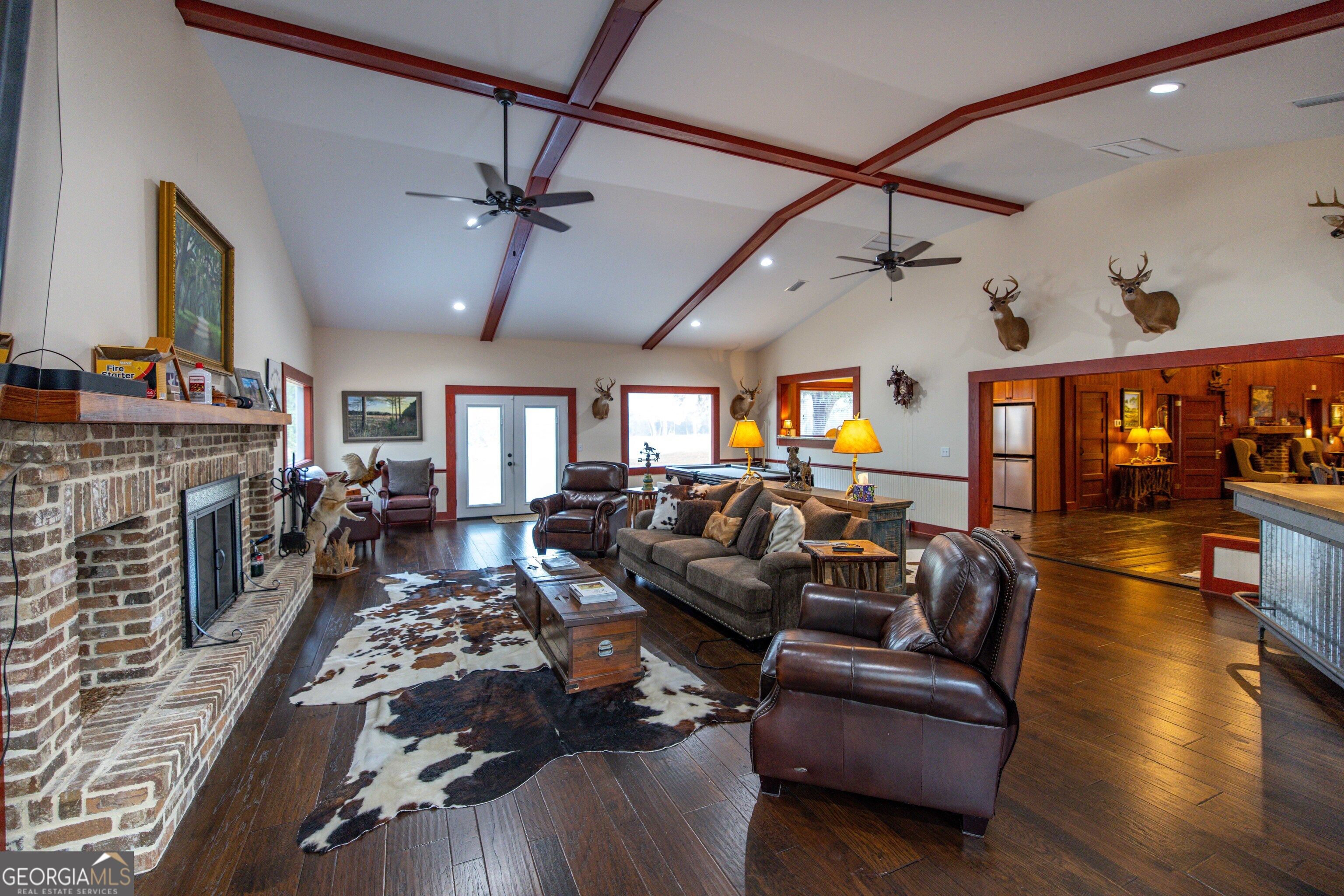 279 Mid River Road White Oak, GA 31568 - Photo 8 of 62 a living room with fireplace furniture and a fireplace