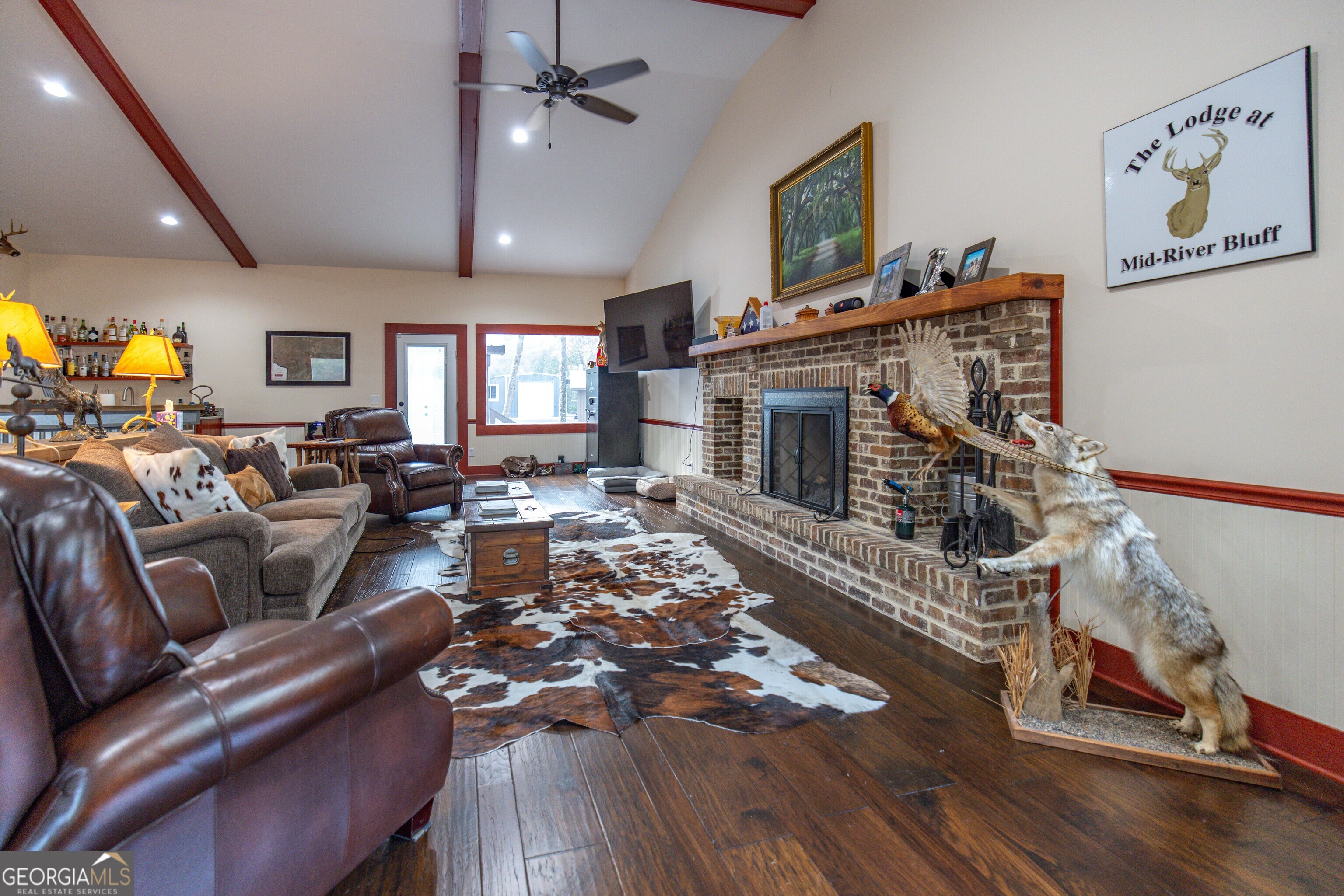 279 Mid River Road White Oak, GA 31568 - Photo 9 of 62 a living room with furniture and a fireplace