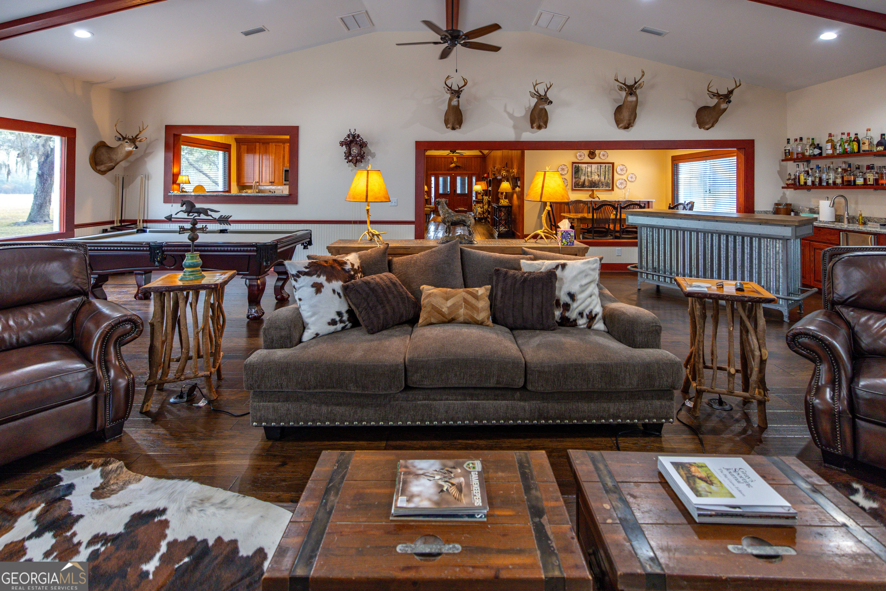 279 Mid River Road White Oak, GA 31568 - Photo 10 of 62 a living room with furniture and a flat screen tv