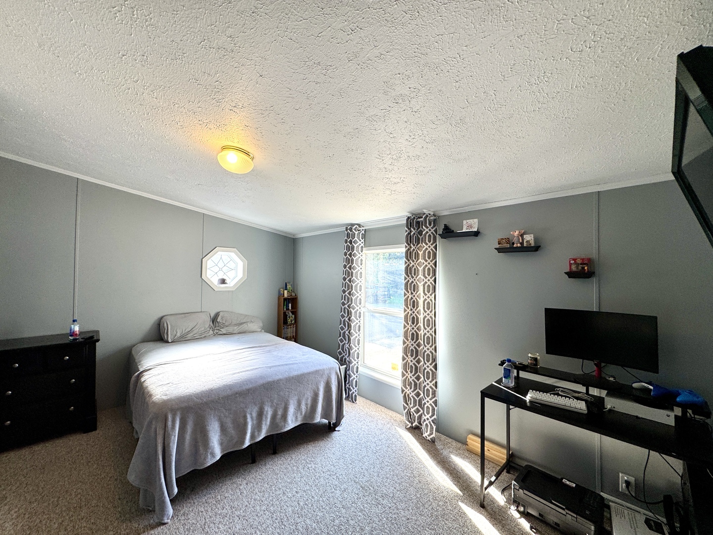 236 Brandy Avenue Princeton, IL 61356 - Photo 12 of 22 a bedroom with a bed and a tv on the dresser