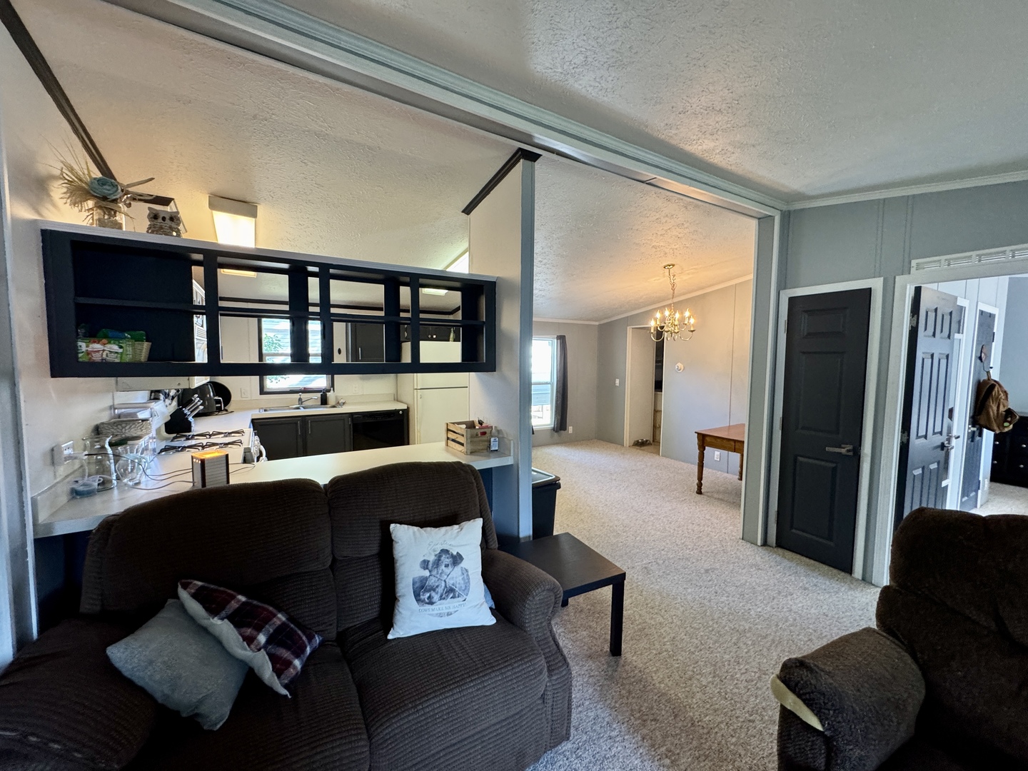 236 Brandy Avenue Princeton, IL 61356 - Photo 4 of 22 a living room with furniture flat screen tv and a refrigerator