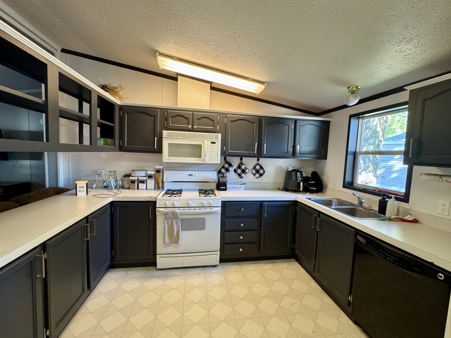 236 Brandy Avenue Princeton, IL 61356 - Photo 7 of 22 a kitchen with stainless steel appliances granite countertop a sink stove and cabinets
