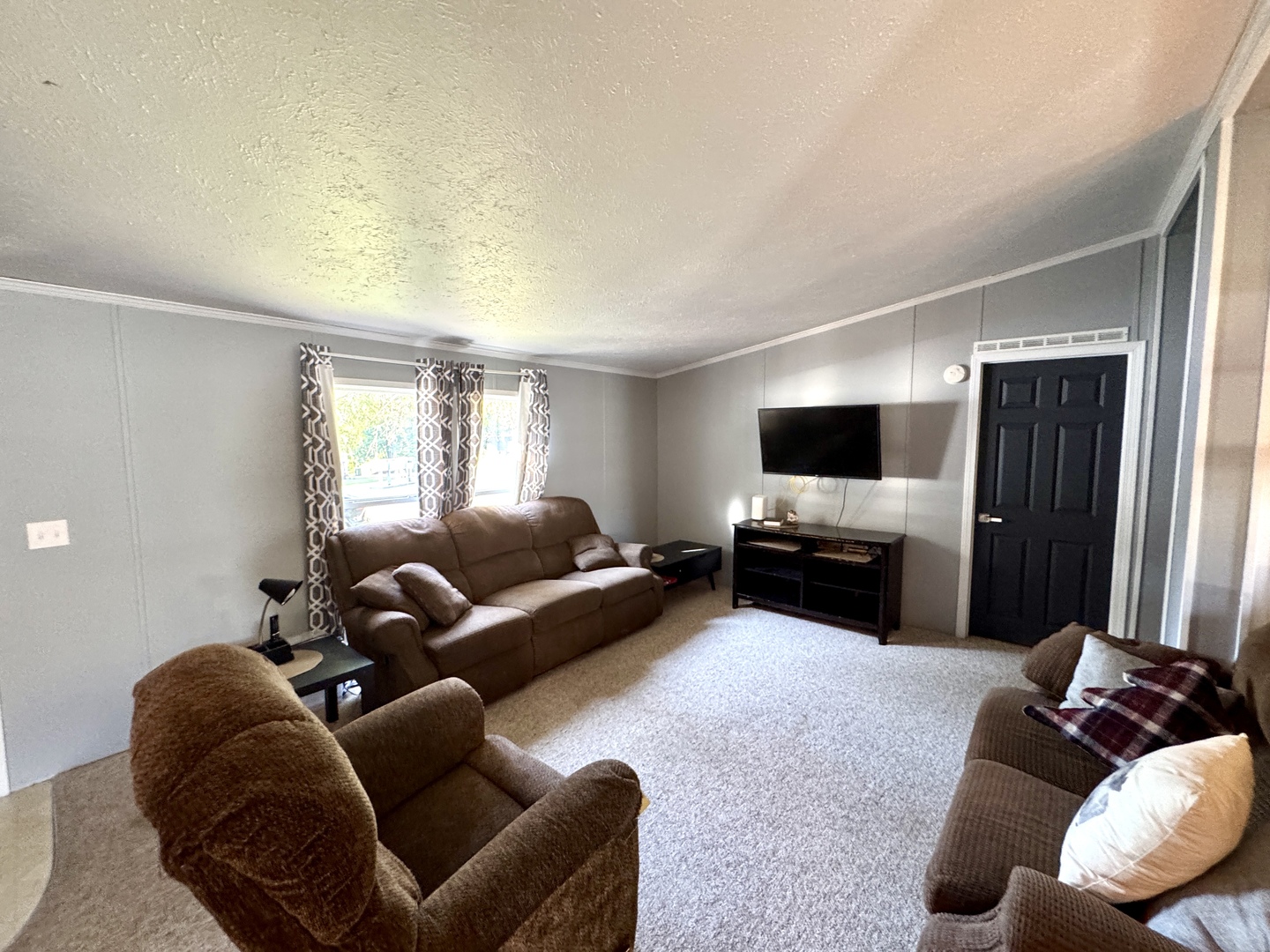 236 Brandy Avenue Princeton, IL 61356 - Photo 8 of 22 a living room with furniture and a flat screen tv