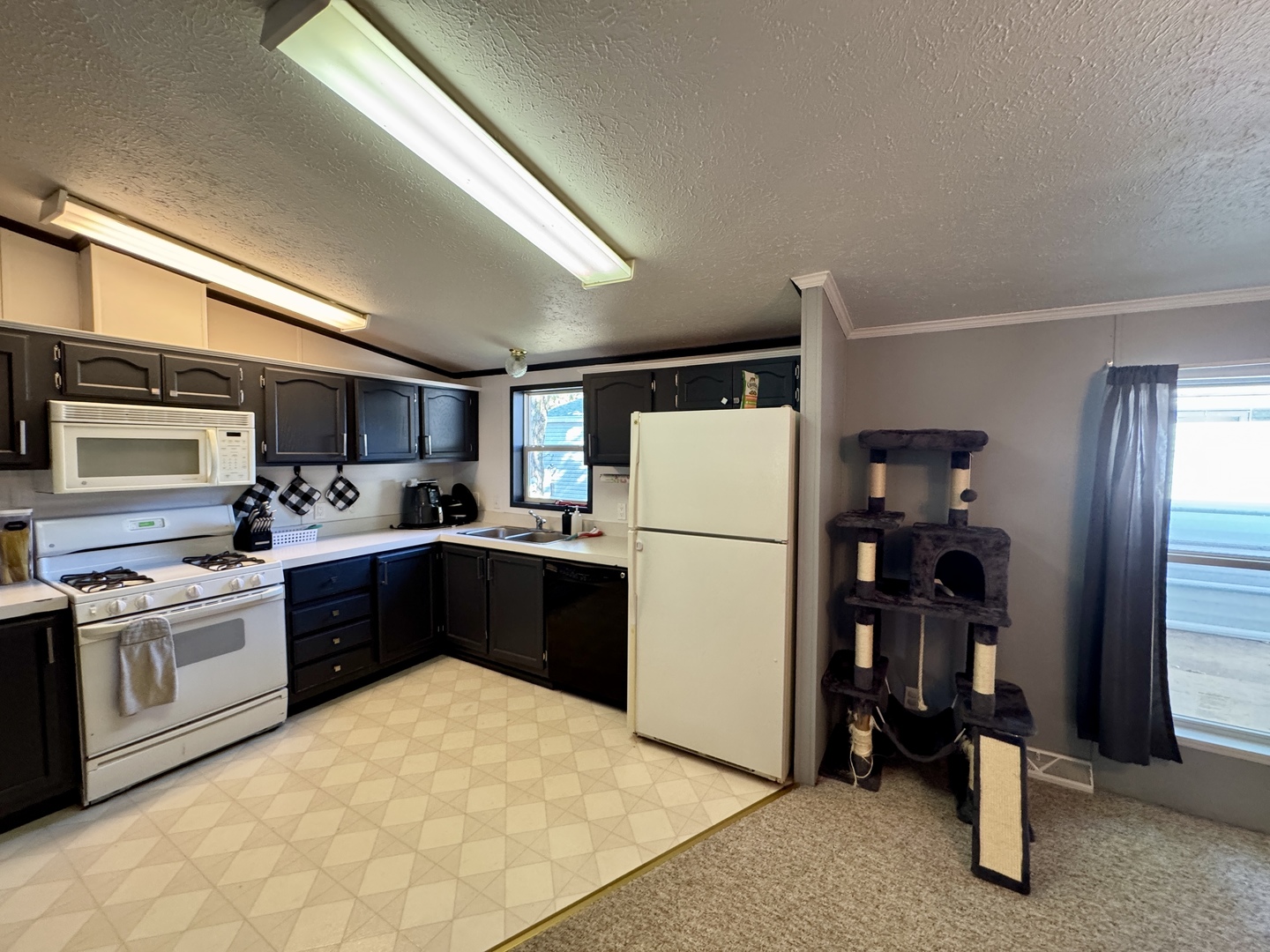 236 Brandy Avenue Princeton, IL 61356 - Photo 10 of 22 a kitchen with a refrigerator and a stove top oven
