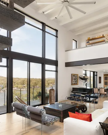 a view of house with swimming pool and lake view