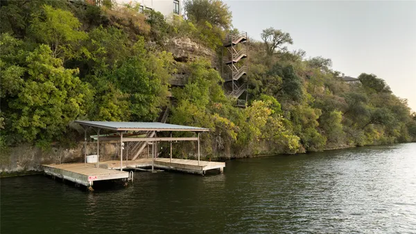 a view of a patio with wooden floor and outdoor seating