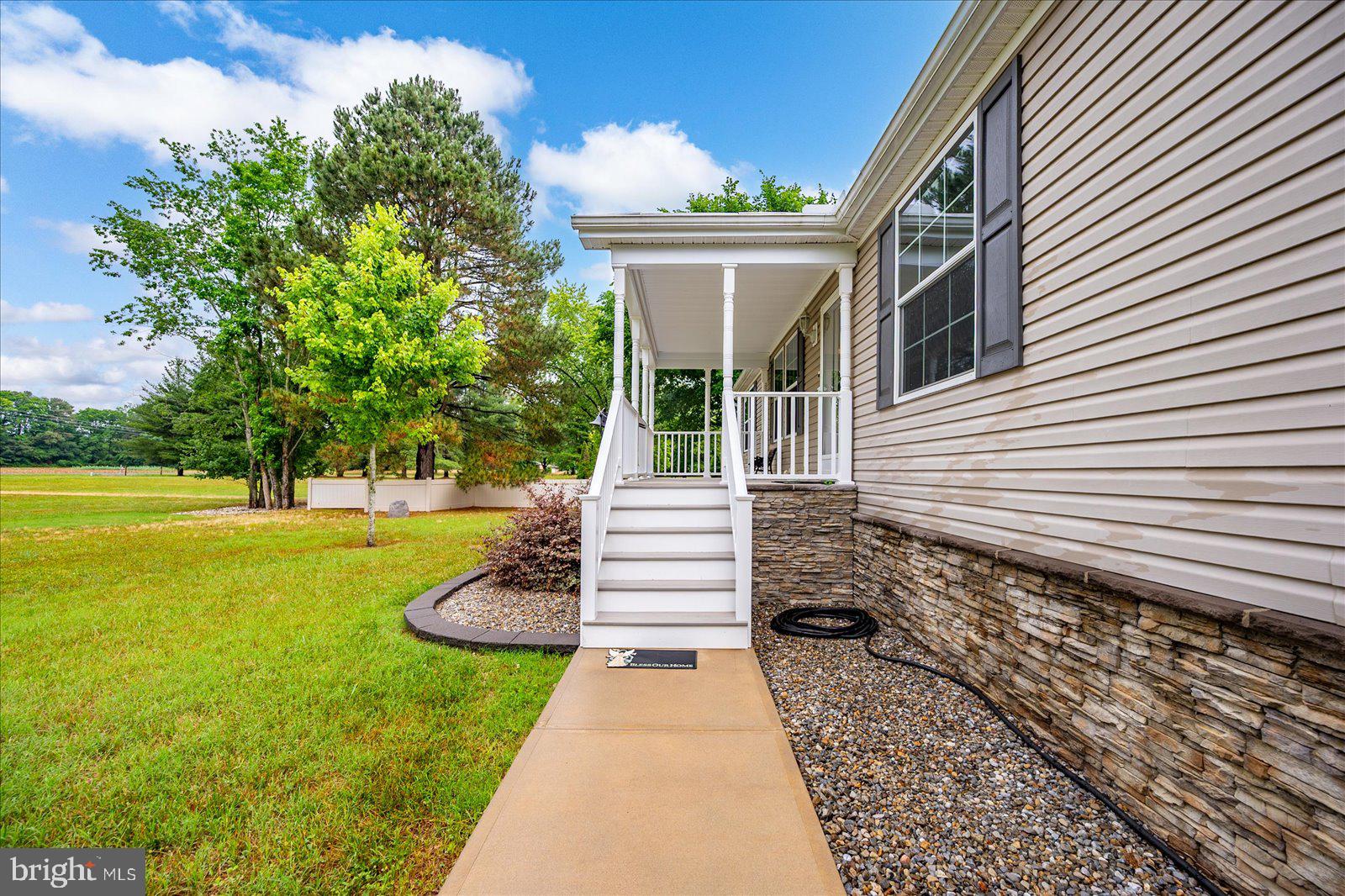 8225 Whitesville Road Pittsville, MD 21850 - Photo 4 of 45 a front view of a house with a garden
