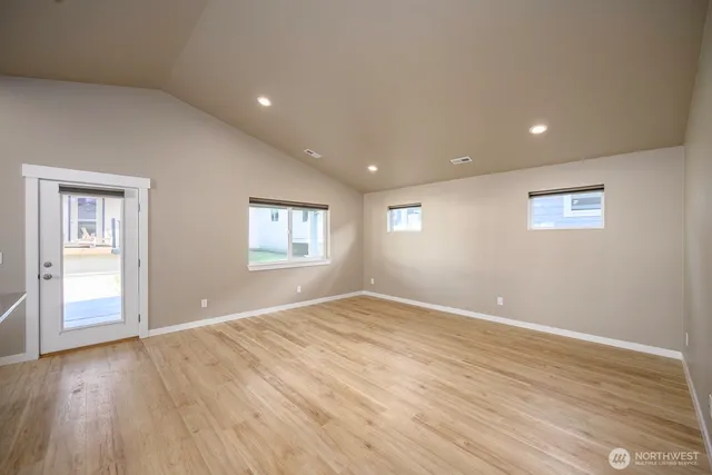 a bathroom with a granite countertop sink a toilet and shower