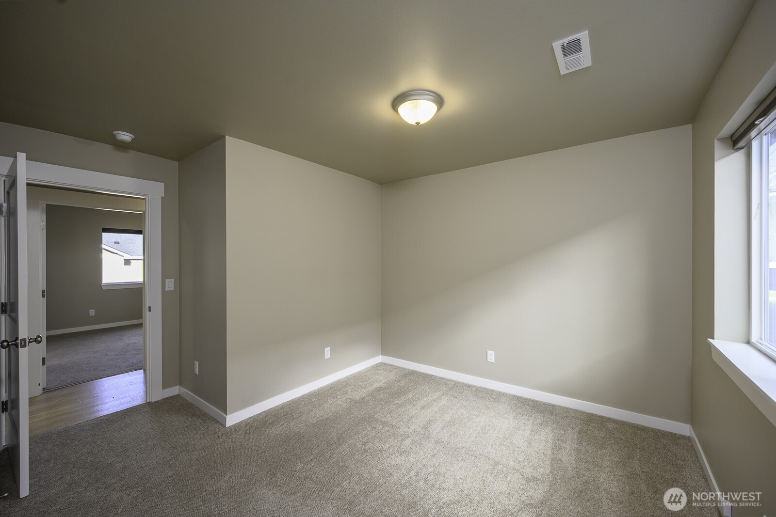 123 9th Avenue, Unit 50 Moses Lake, WA 98837 - Photo 20 of 34 wooden floor in an empty room with a window