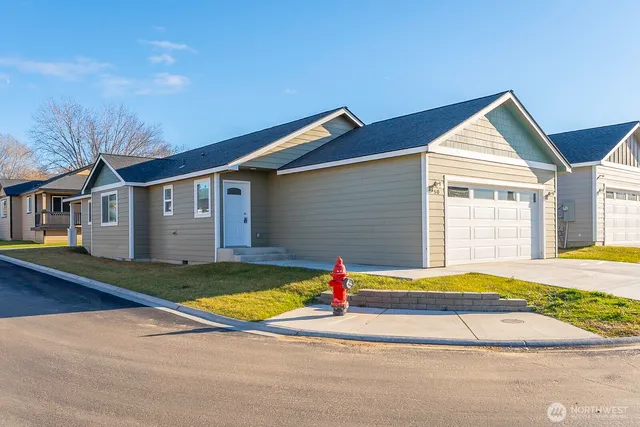 a front view of house with yard and swimming pool