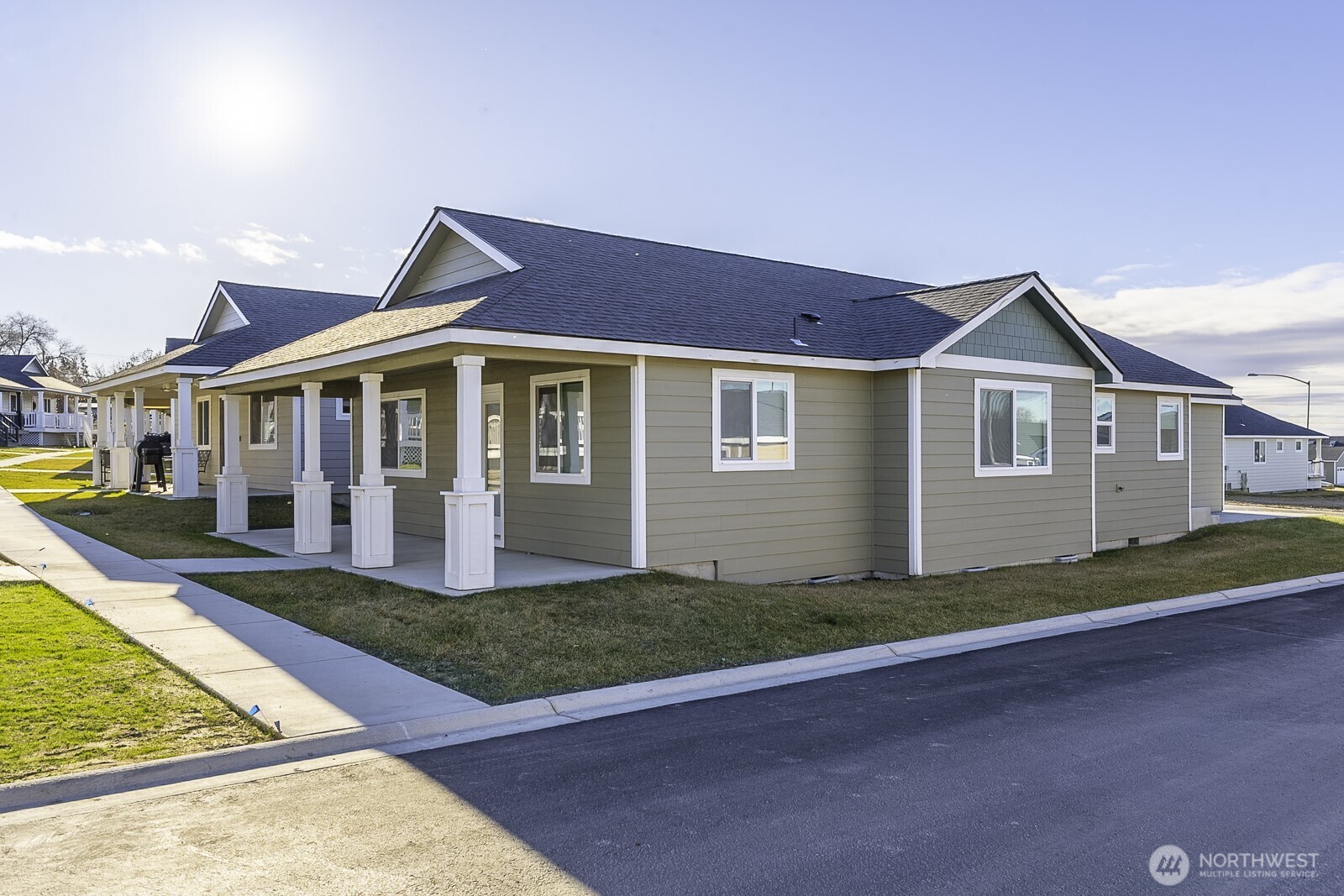123 9th Avenue, Unit 50 Moses Lake, WA 98837 - Photo 31 of 34 a front view of a house with a yard