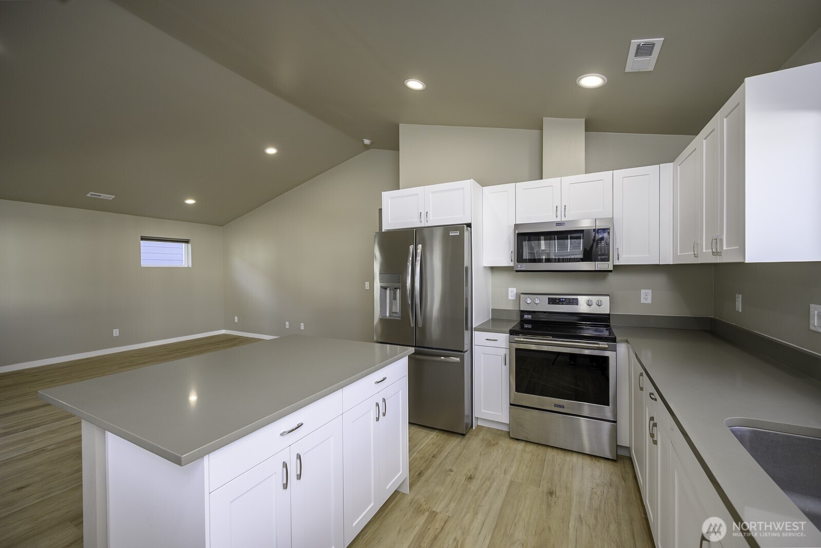 123 9th Avenue, Unit 50 Moses Lake, WA 98837 - Photo 8 of 34 a kitchen with stainless steel appliances granite countertop a sink stove and refrigerator