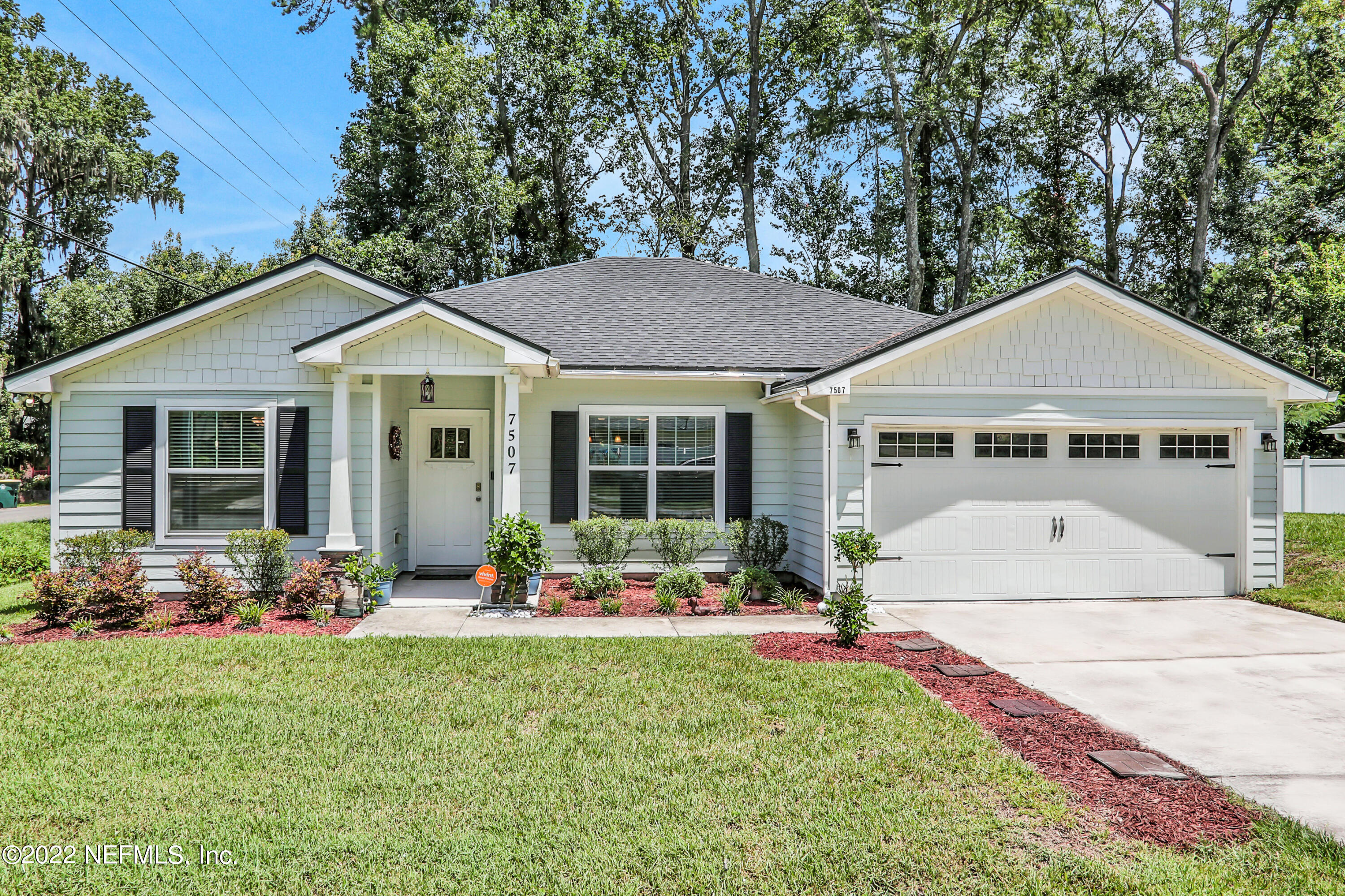 7507 Hilsdale Road Jacksonville, FL 32216 - Photo 1 of 38 a front view of a house with garden