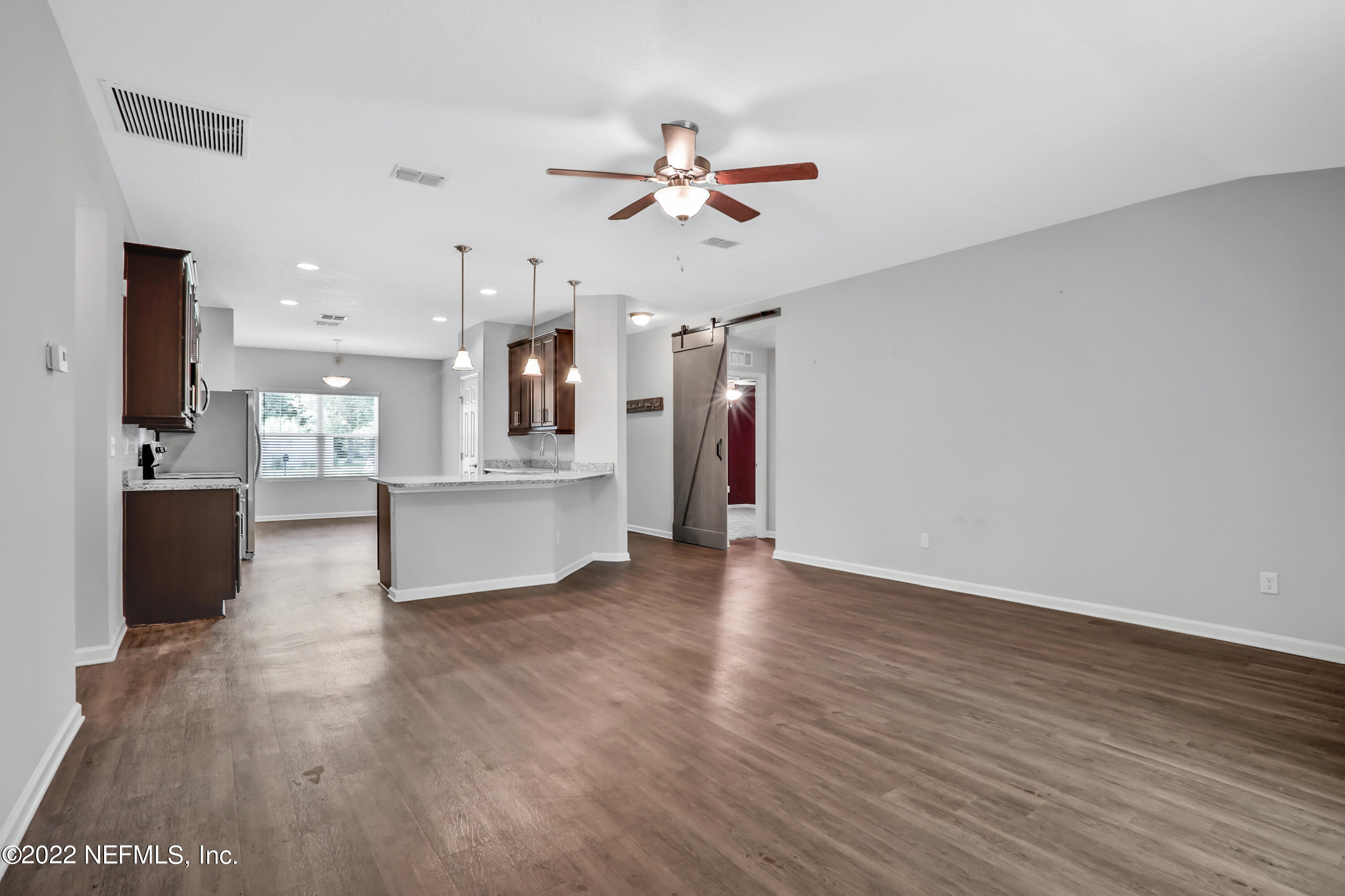 7507 Hilsdale Road Jacksonville, FL 32216 - Photo 14 of 38 a view of a kitchen with wooden floor and a kitchen