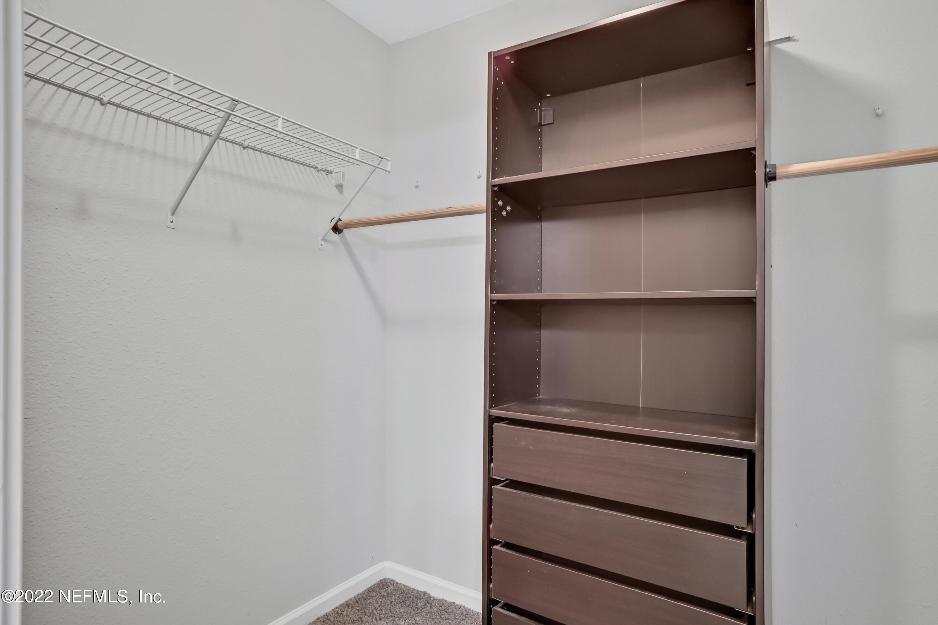 7507 Hilsdale Road Jacksonville, FL 32216 - Photo 22 of 38 a view of an empty walk in closet